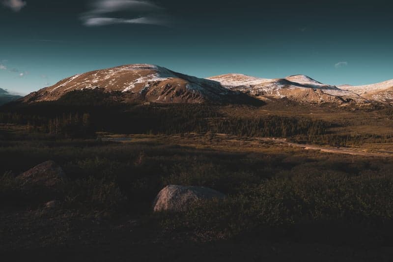 Golden light illuminating a mountain summit