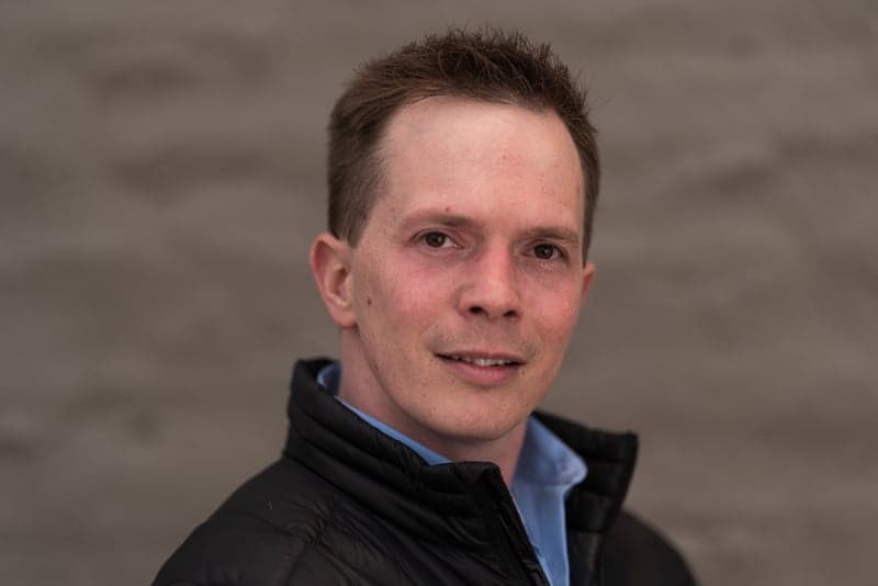 A mountain ridge under the night sky with stars emerging