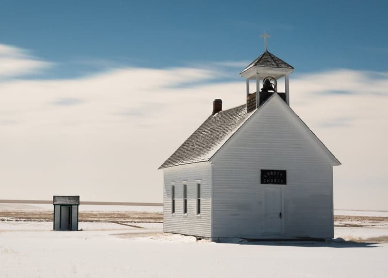 Night sky reflected in still alpine water with stars shimmering