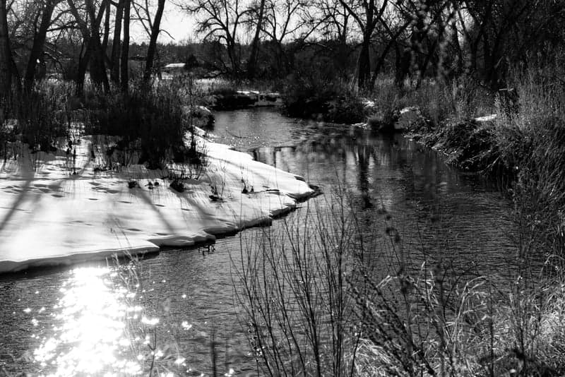 Soft light illuminating a vast snowfield in the mountains