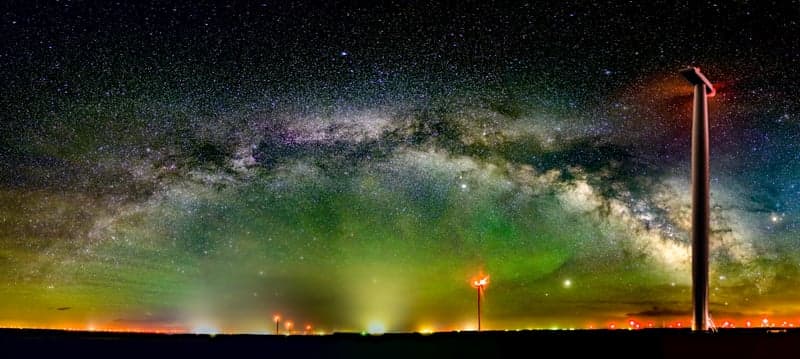 Deep sky astrophotography composite showing faint nebulae and star fields