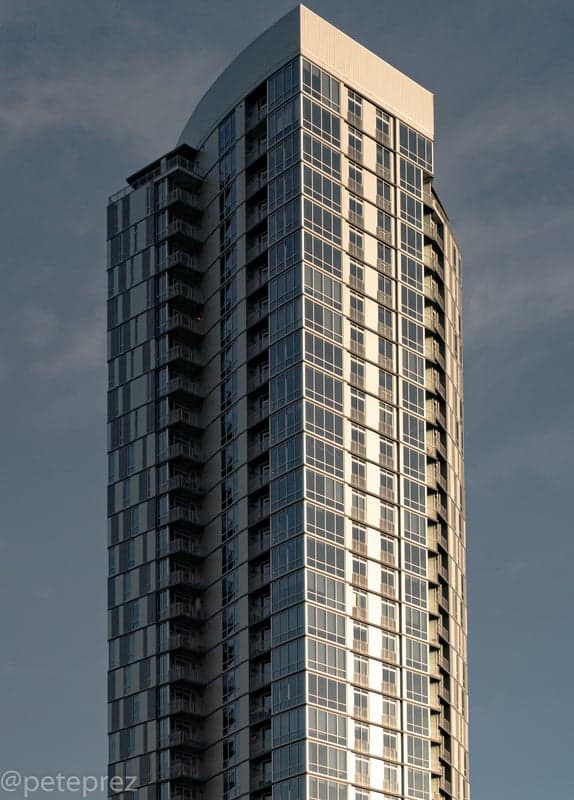 Denver downtown skyline illuminated at night with city lights reflecting