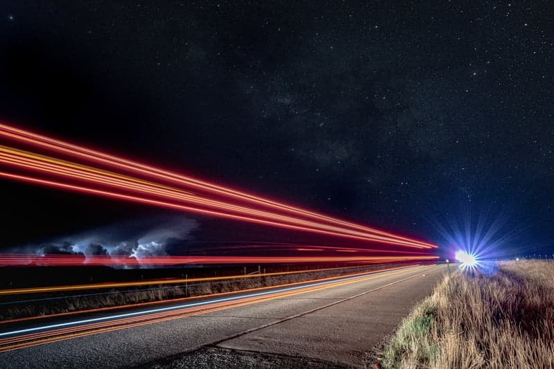 Long exposure star trails forming concentric arcs across the sky